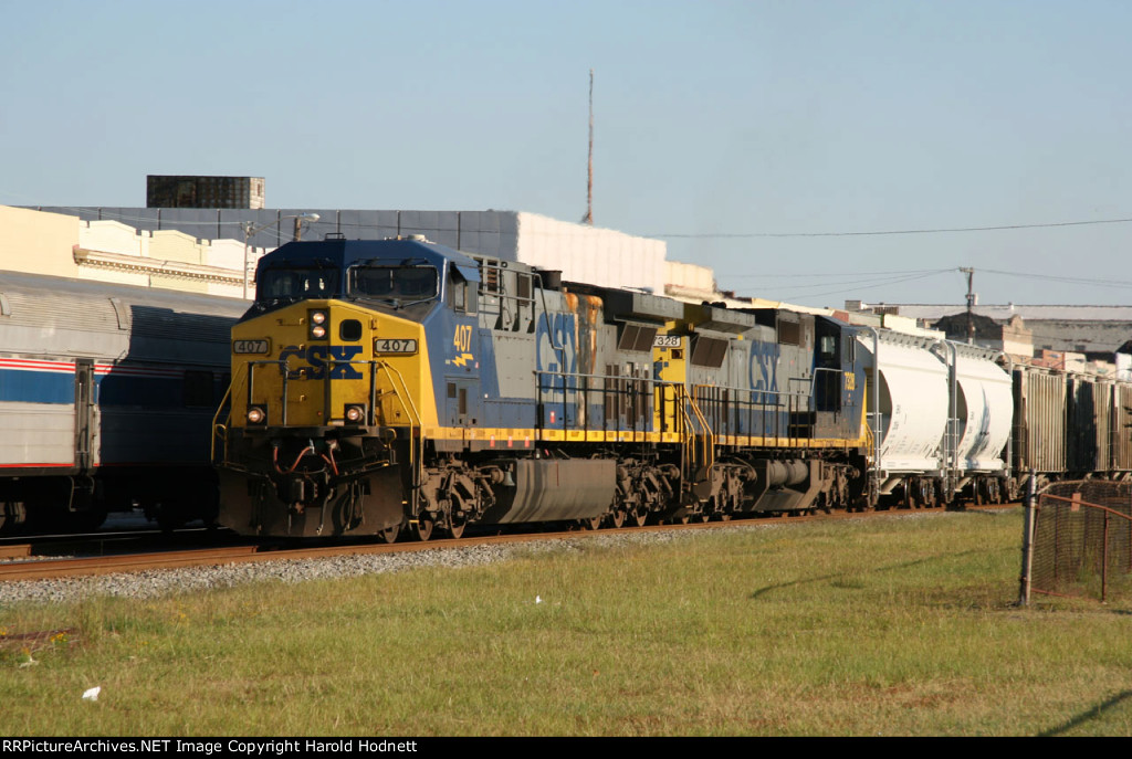 CSX 407 & 7328 lead train Q451 past train P092 at the station